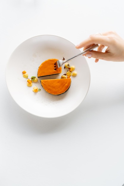 Hands plating a dessert